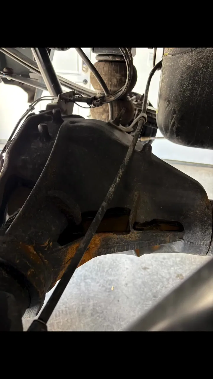 Before Waxoyl application showing exposed rust and untreated areas on a customer truck